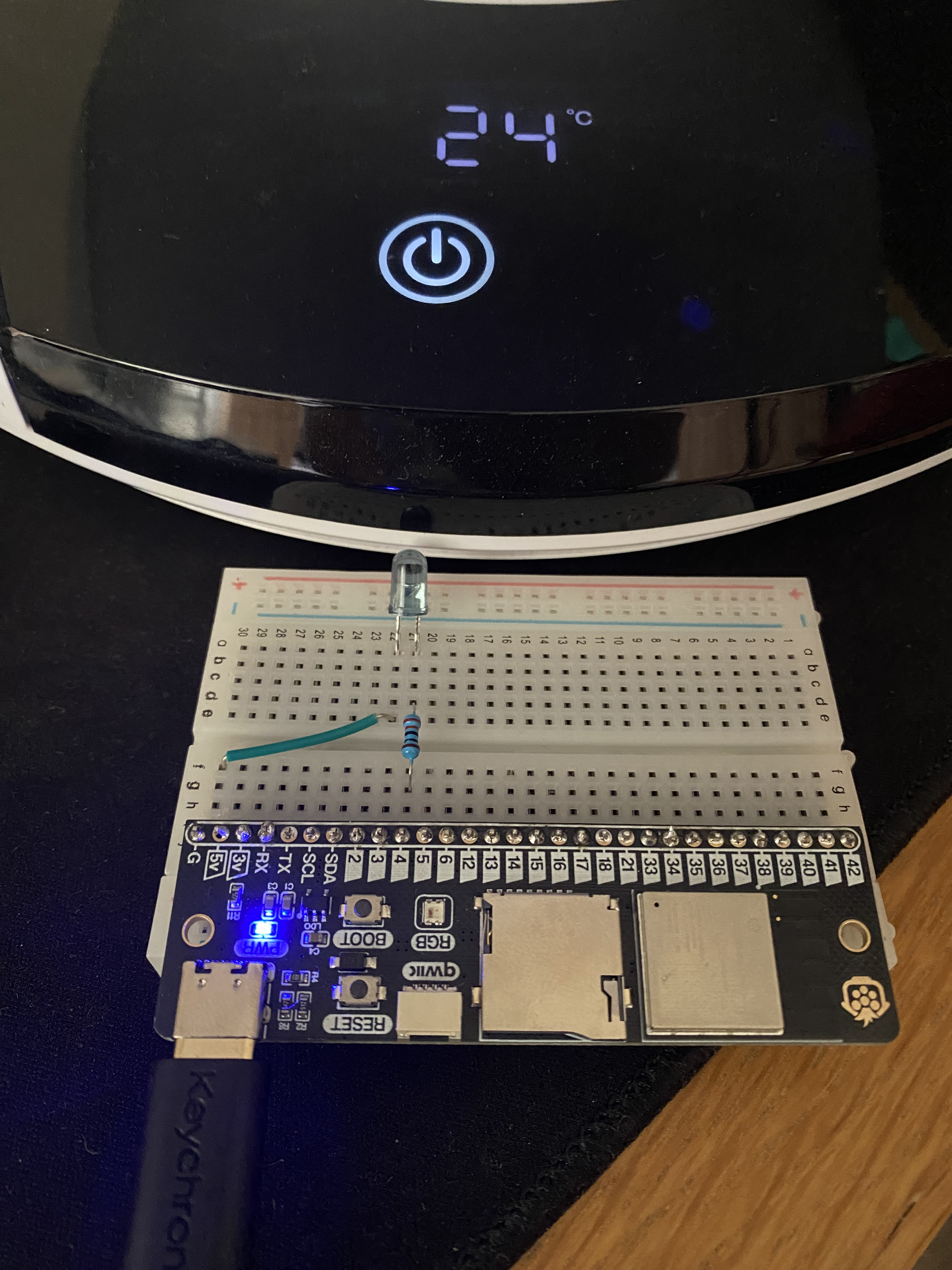 Showing the breadboard with power next to the fan base